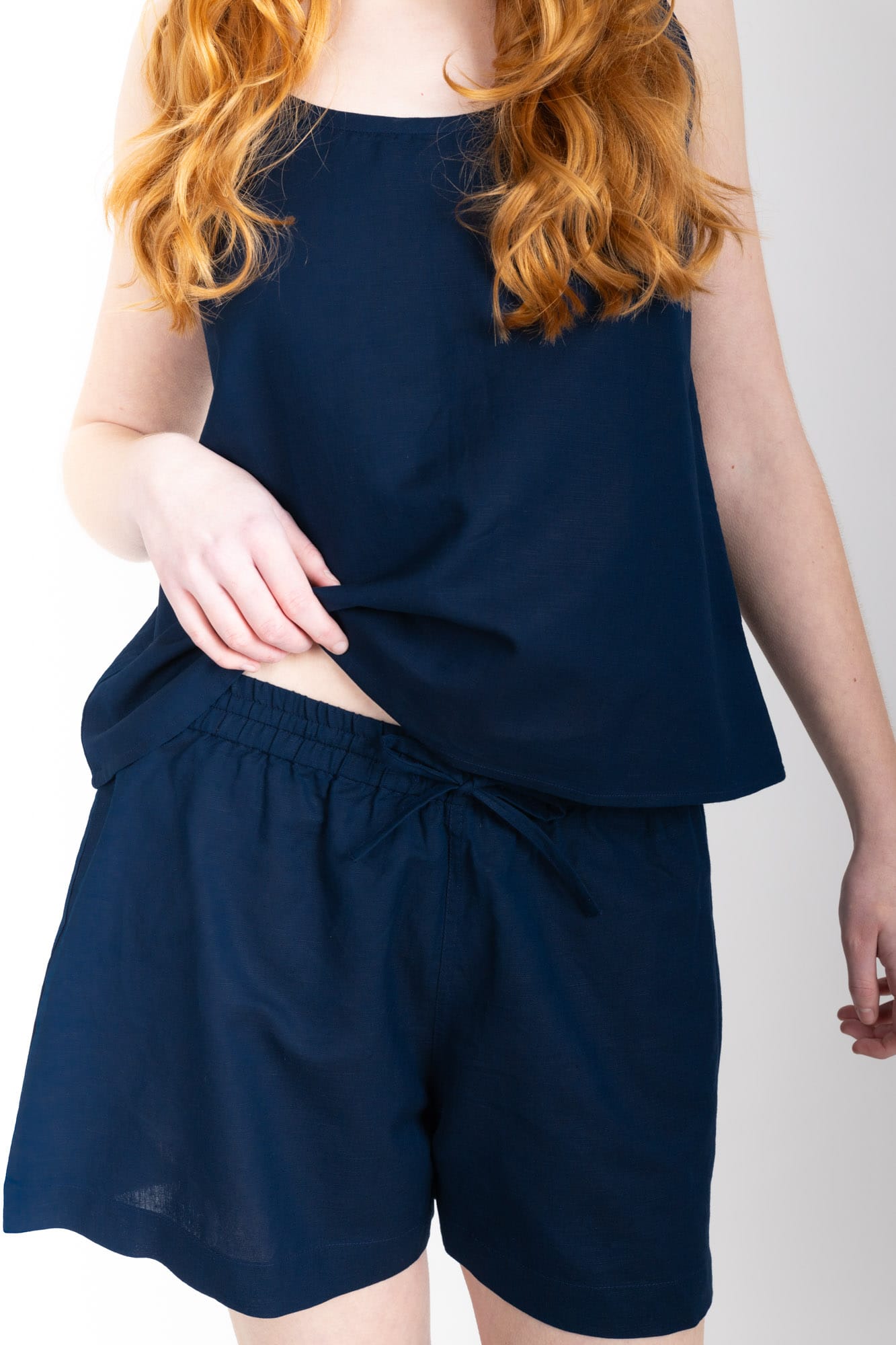 General Sleep Summer Set with a swing-style camisole,  with shorts with elasticated-waistband  and drawstring detail. 55% organic cotton and 45% linen blend, in Navy.