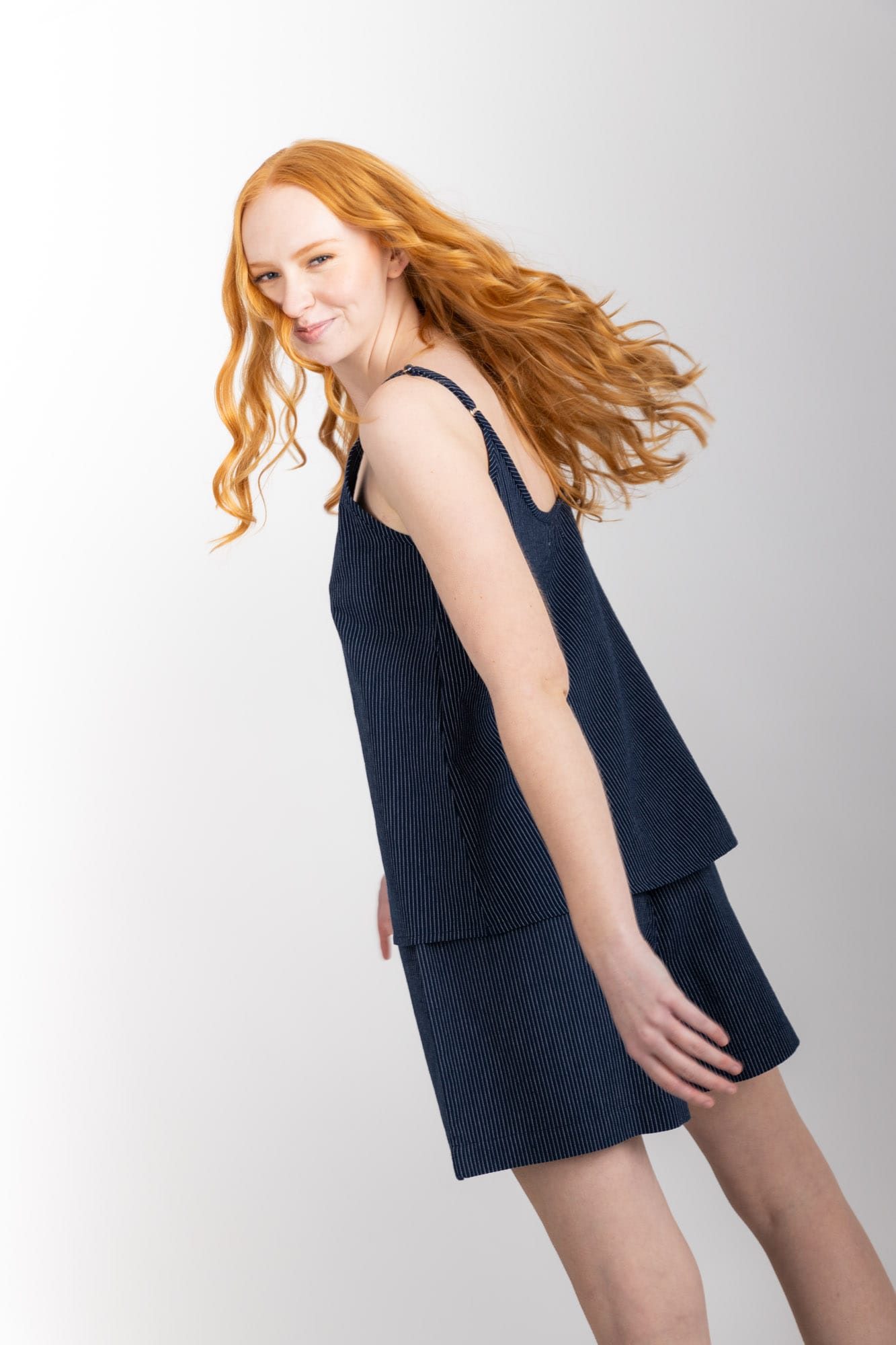 General Sleep Summer Set with a swing-style camisole,  with shorts with elasticated-waistband  and drawstring detail. 100% organic cotton, in a Navy Pinstripe.  
